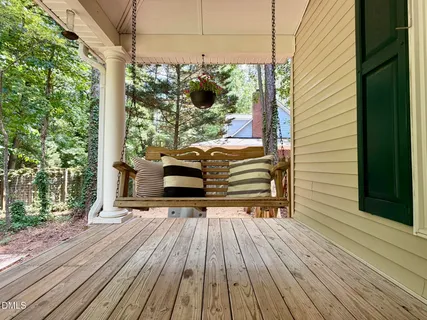 a view of outdoor sitting area with furniture and backyard