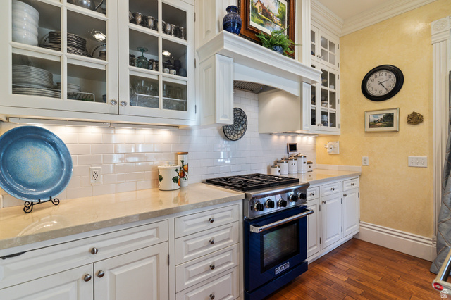 390 North 100 West Monroe, UT 84754 - Photo 112 of 167 Kitchen with white cabinets, range with gas cooktop, dark wood finished floors, light stone counters, and ornamental molding