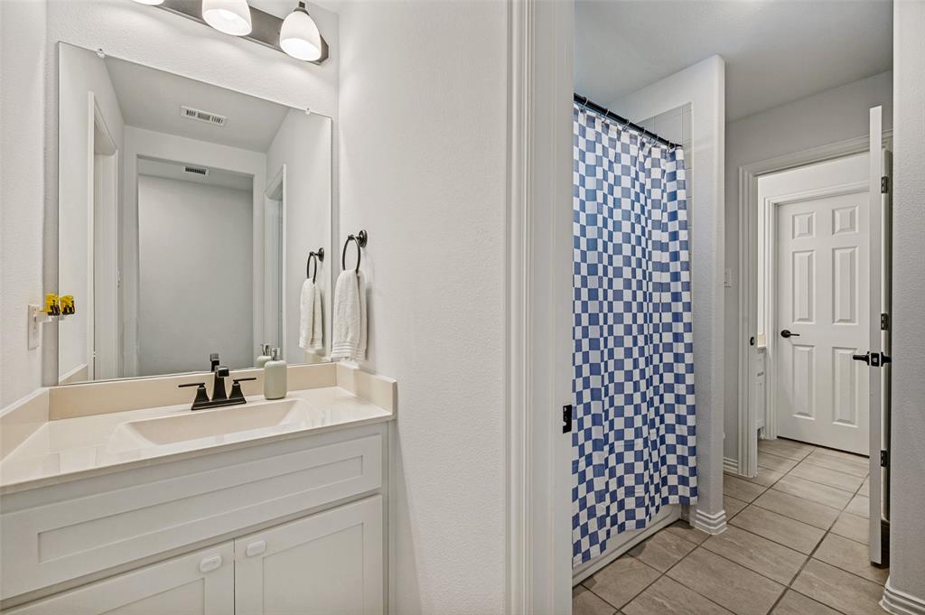 808 Violet Way Celina, TX 75009 - Photo 22 of 30 Full Jack and Hill bathroom with a shower, vanity, tile floors