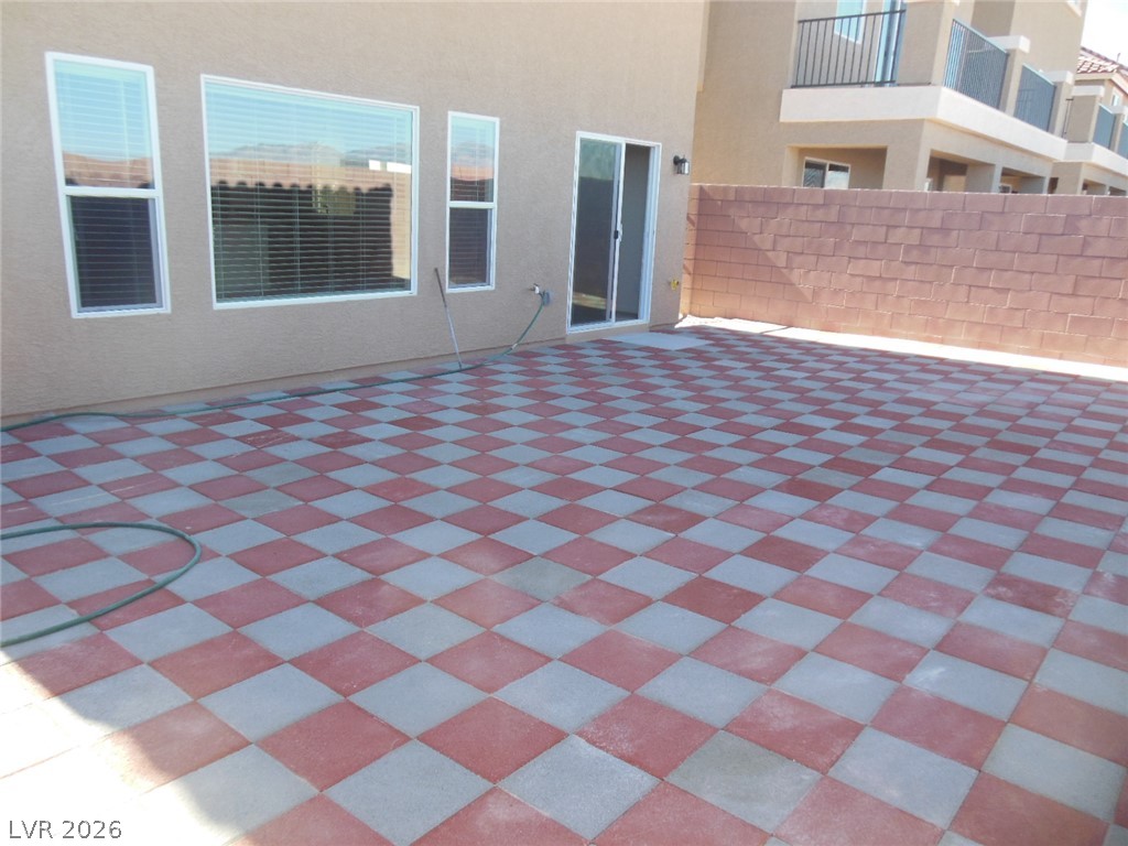 6390 Jackson Spring Road Las Vegas, NV 89118 - Photo 26 of 27 A spacious checkered patio offers ample room for outdoor relaxation and entertaining.