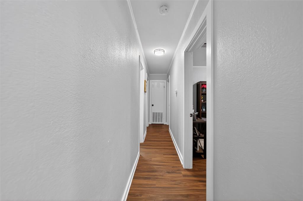 614 Colonial Drive Athens, TX 75751 - Photo 14 of 26 a view of a hallway with wooden floor