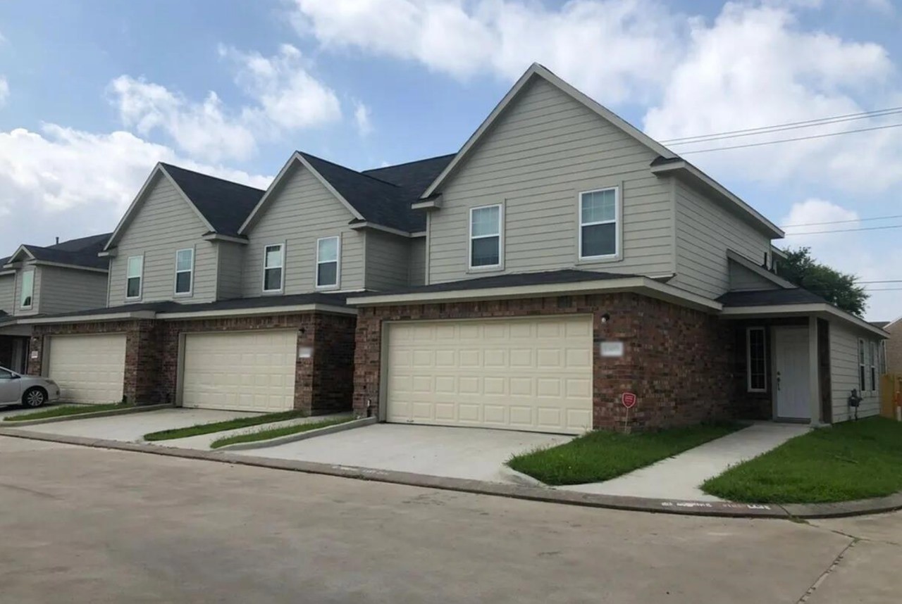 12010 Sarah Lake Drive Houston, TX 77099 - Photo 1 of 20 a front view of a house with a yard and garage