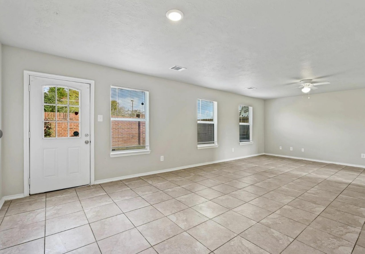 12010 Sarah Lake Drive Houston, TX 77099 - Photo 12 of 20 an empty room with windows and closet