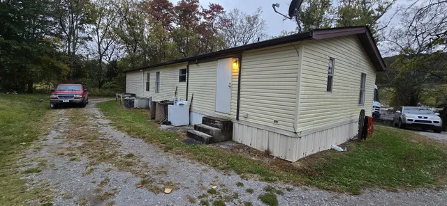a view of a house with a yard