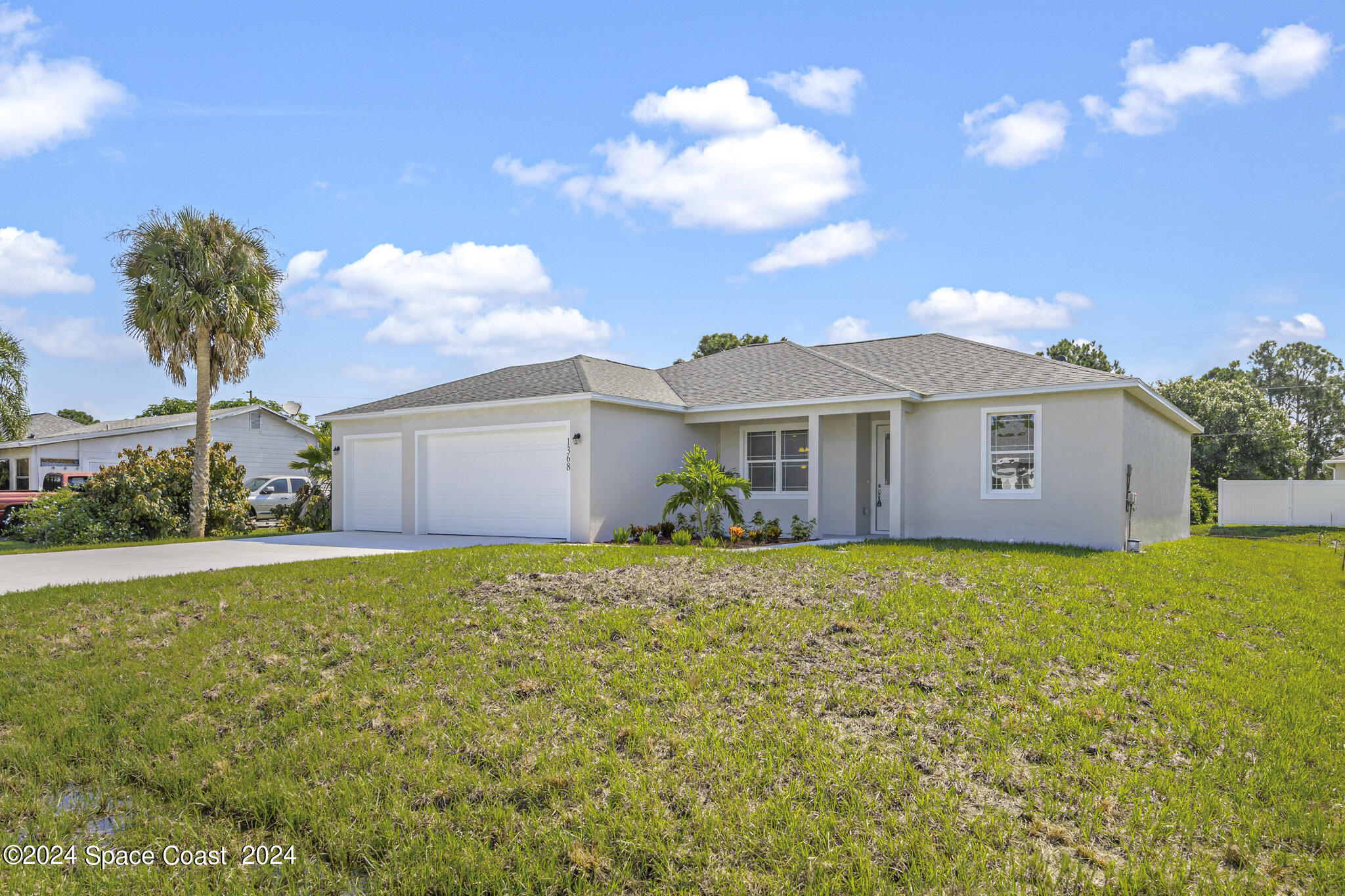 1368 Rabbit Street Southeast Palm Bay, FL 32909 - Photo 1 of 31 a view of a house with backyard and garden