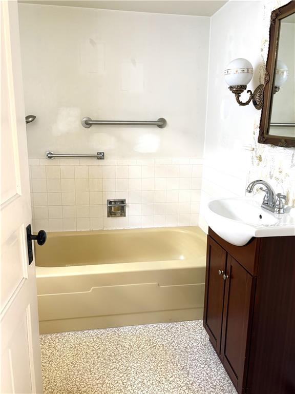 1920 Ridge Avenue New Kensington, PA 15068 - Photo 17 of 19 a bathroom with a sink a bathtub and a shower
