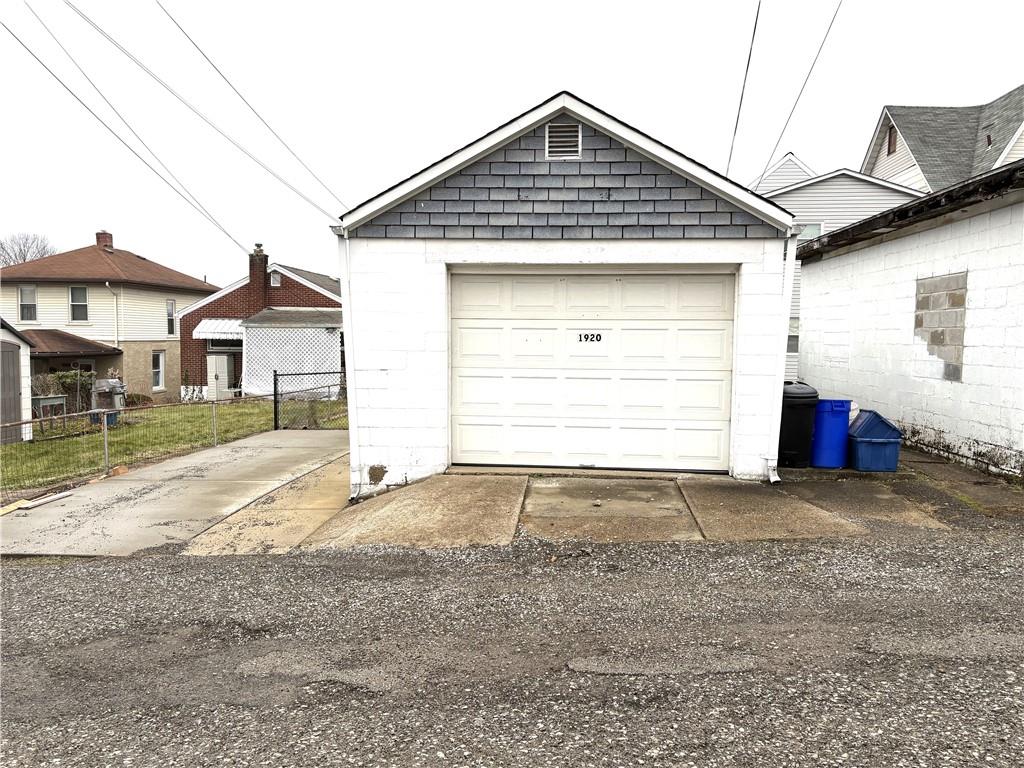 1920 Ridge Avenue New Kensington, PA 15068 - Photo 19 of 19 a front view of a house with a yard and garage