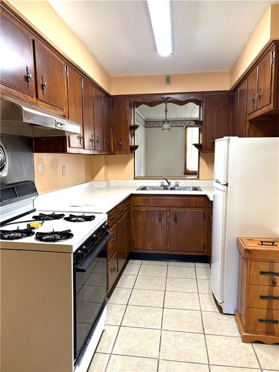 1920 Ridge Avenue New Kensington, PA 15068 - Photo 9 of 19 a kitchen with a stove a sink dishwasher and a refrigerator