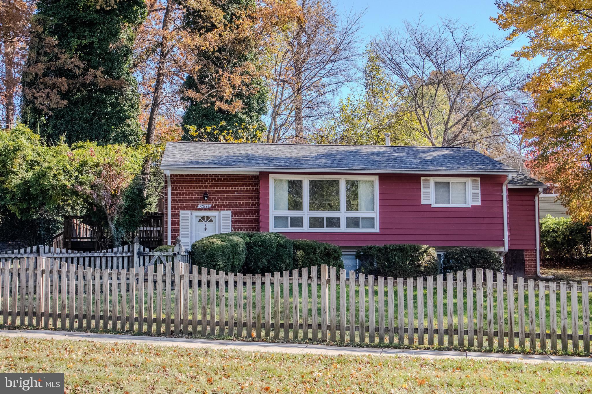12835 Littleton Street Silver Spring, MD 20906 - Photo 2 of 2 a front view of a house with a garden