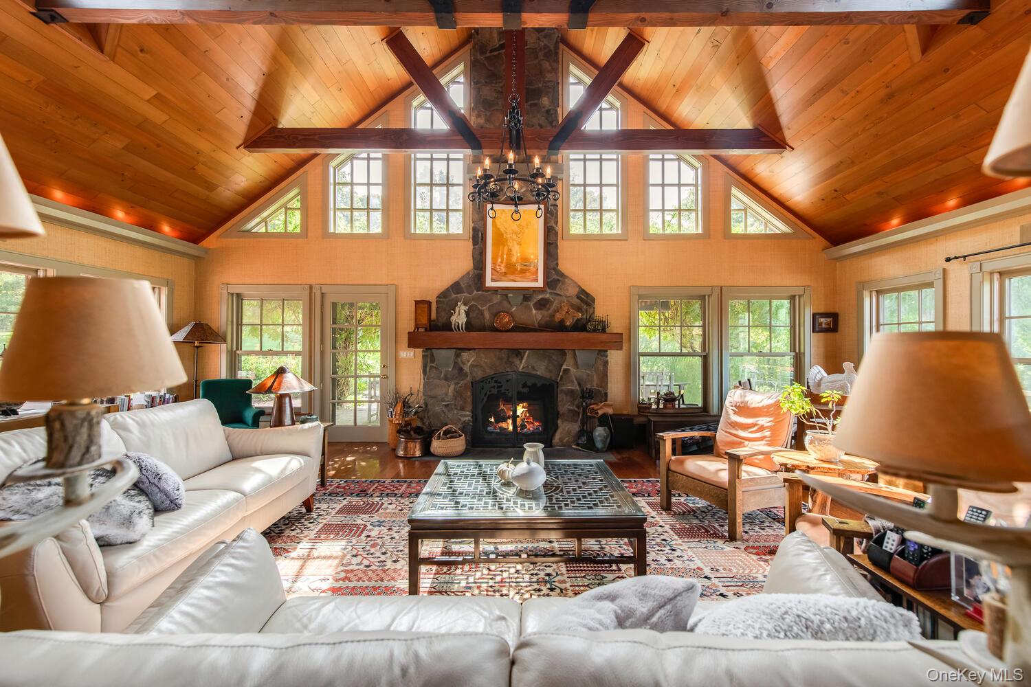 926 Turkey Hill Road Red Hook, NY 12571 - Photo 16 of 50 a living room with furniture a fireplace and a flat screen tv