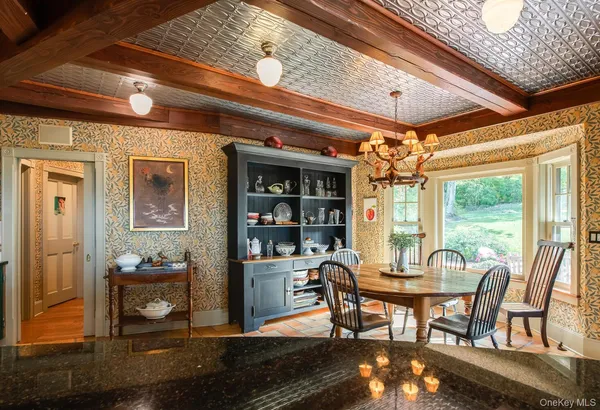 a view of a dining room with furniture window and outside view
