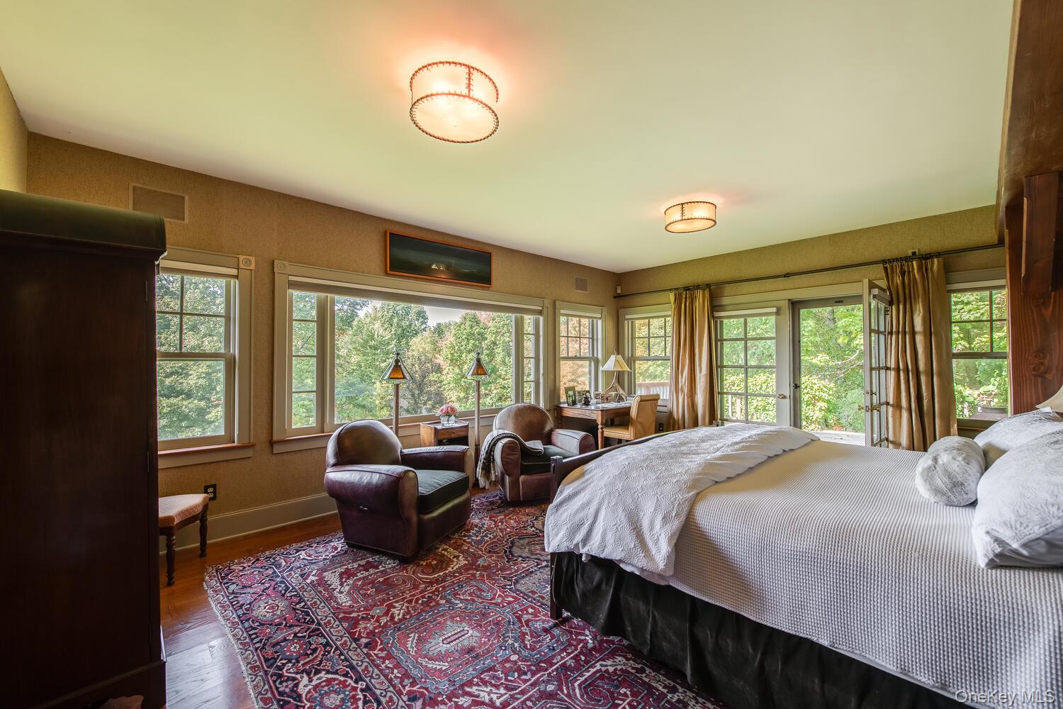 926 Turkey Hill Road Red Hook, NY 12571 - Photo 25 of 50 a spacious bedroom with a bed a table and chair