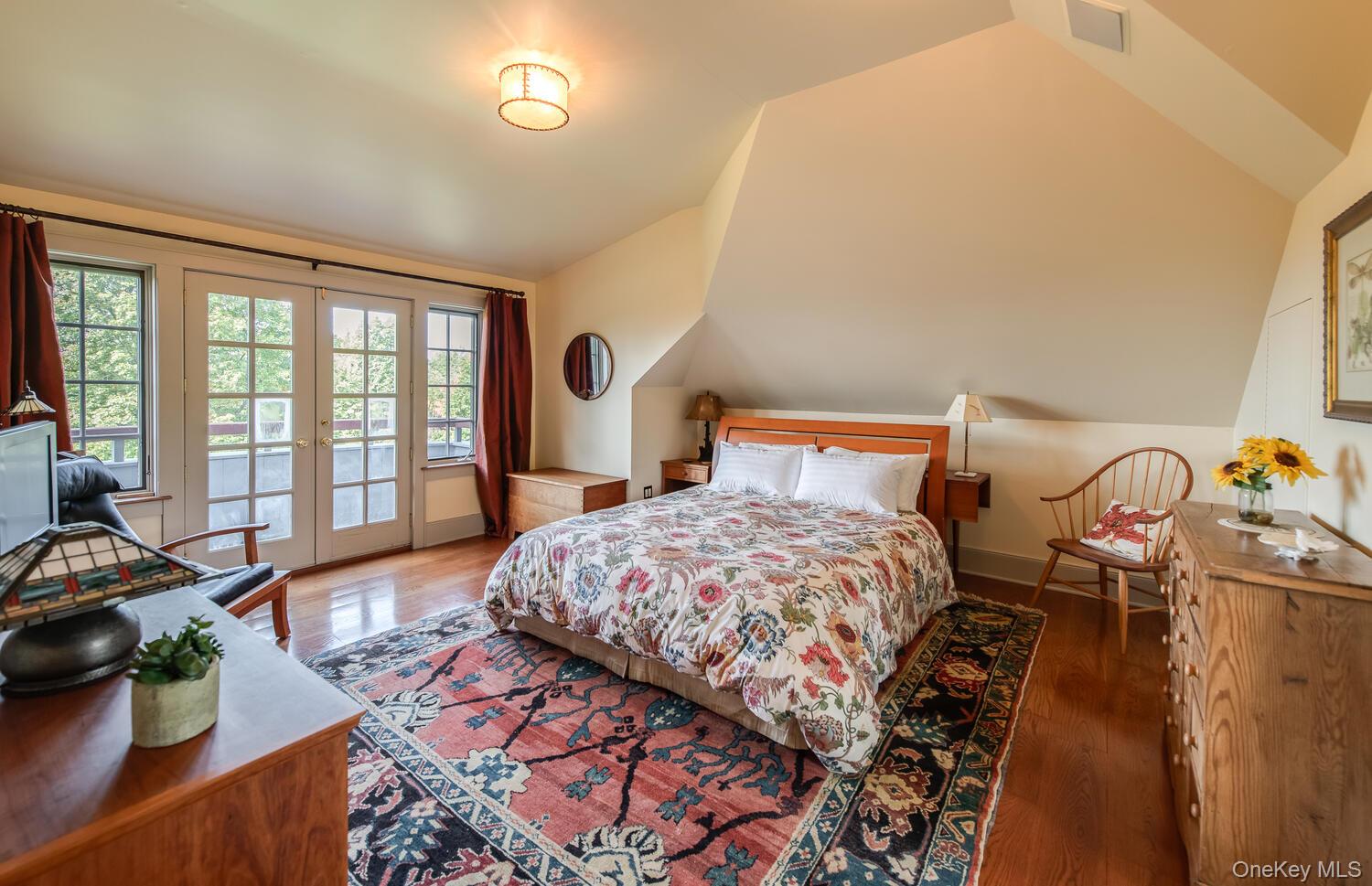 926 Turkey Hill Road Red Hook, NY 12571 - Photo 35 of 50 a bedroom with a bed and wooden floor