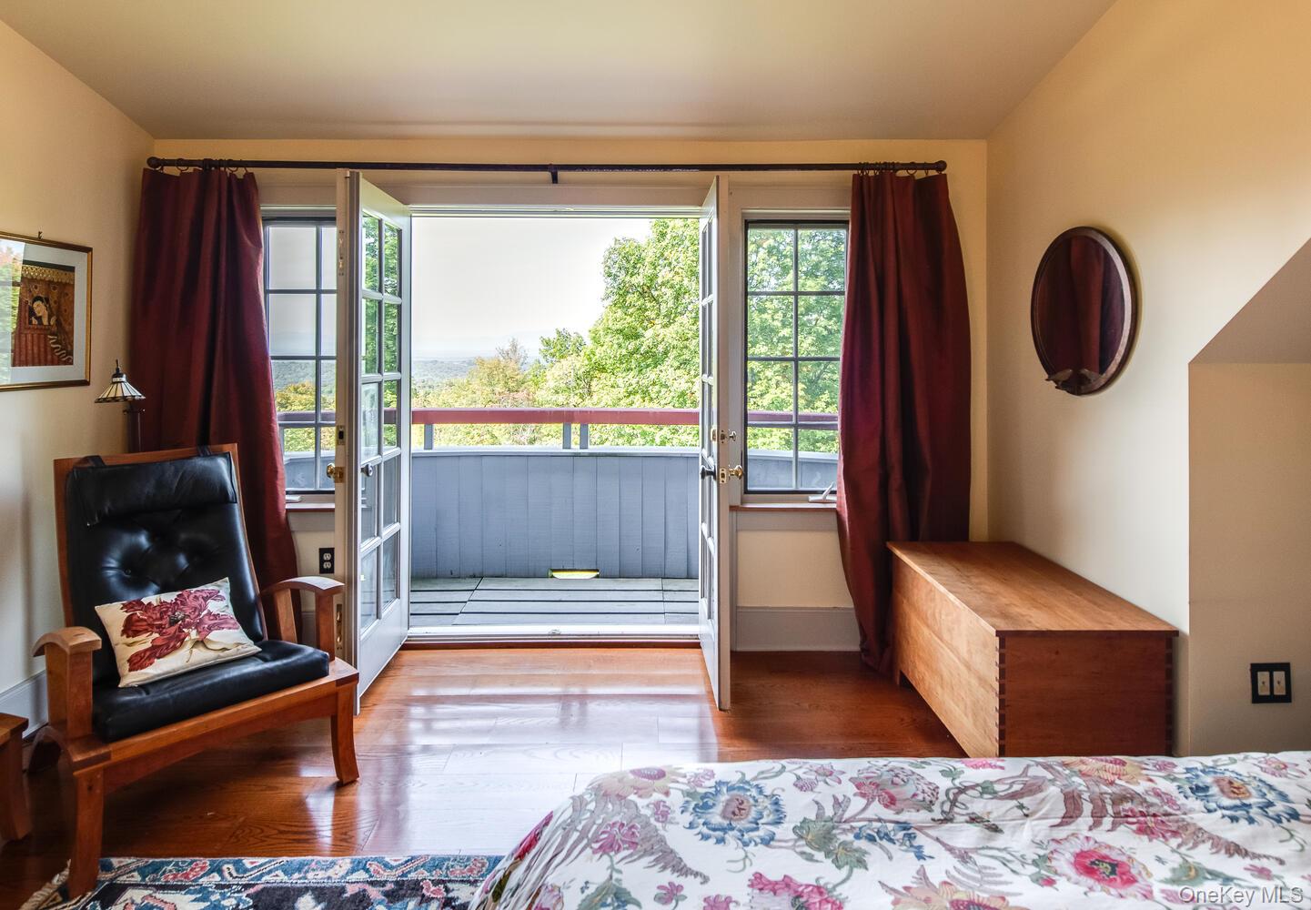 926 Turkey Hill Road Red Hook, NY 12571 - Photo 36 of 50 a bedroom with a bed and wooden floor