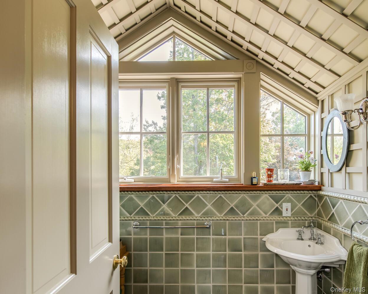 926 Turkey Hill Road Red Hook, NY 12571 - Photo 37 of 50 a bathroom with a sink a mirror and a window