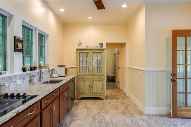 a kitchen with sink cabinets and stove