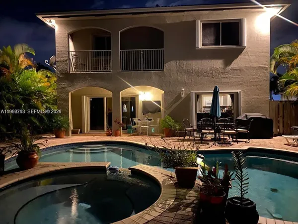 a front view of a house with swimming pool
