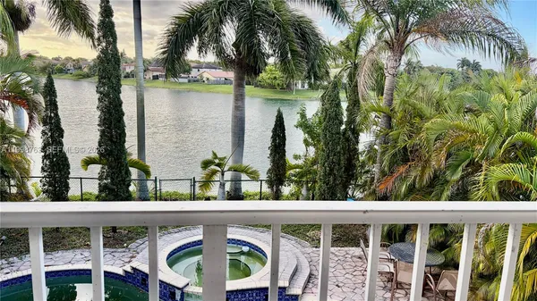 a view of a swimming pool with a garden
