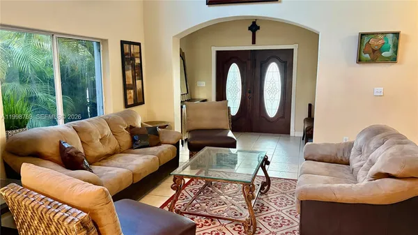 a living room with furniture and a window