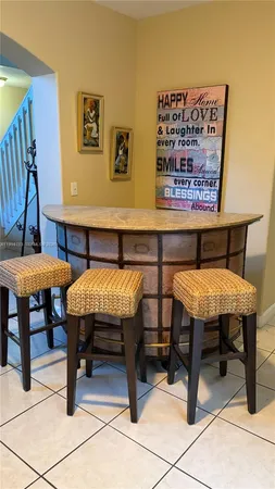 a view of a chairs and table in a room