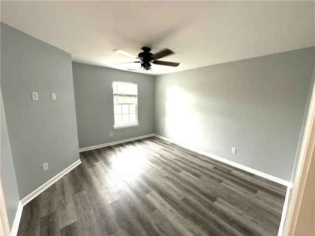 a bathroom with a tub sink and shower