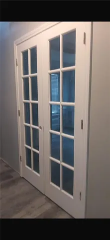 a kitchen with stainless steel appliances kitchen island granite countertop a refrigerator and a stove top oven