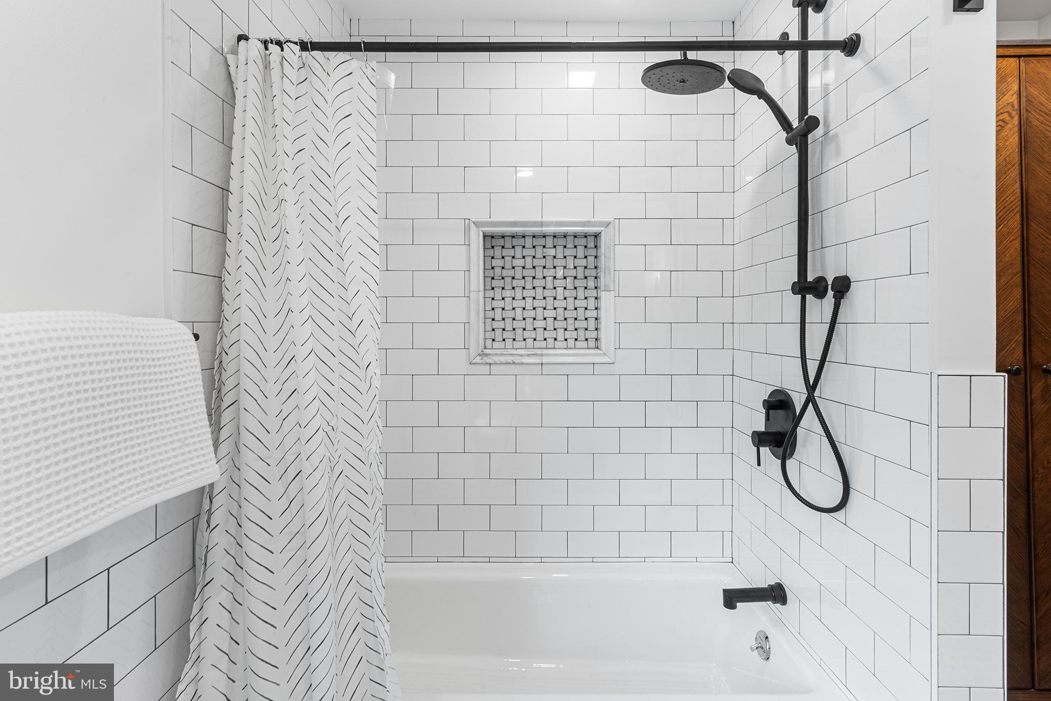 250 Conestoga Road, Unit 2 Wayne, PA 19087 - Photo 15 of 24 a bathroom with a shower and a shower