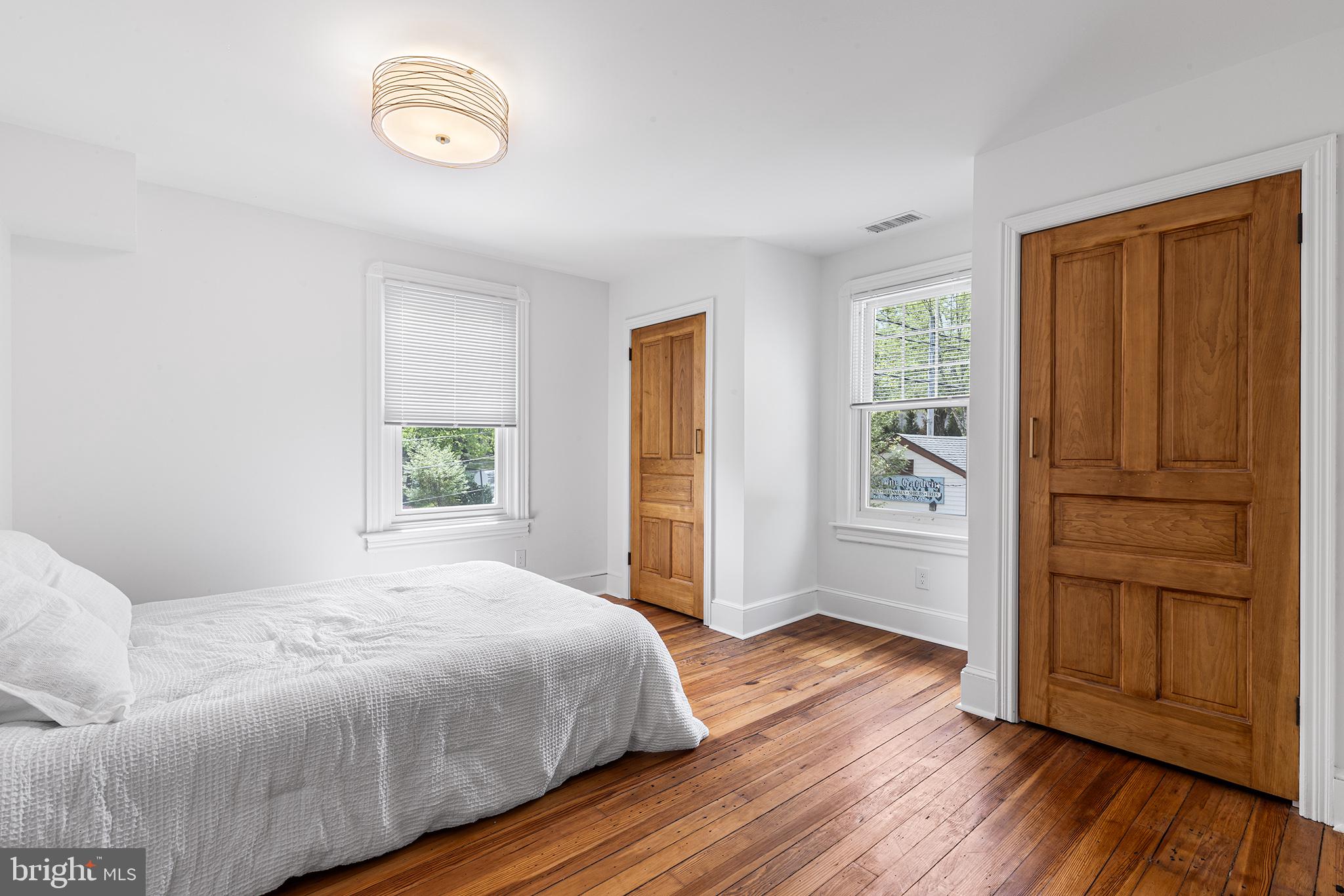 250 Conestoga Road, Unit 2 Wayne, PA 19087 - Photo 16 of 24 a bedroom with a bed and a window
