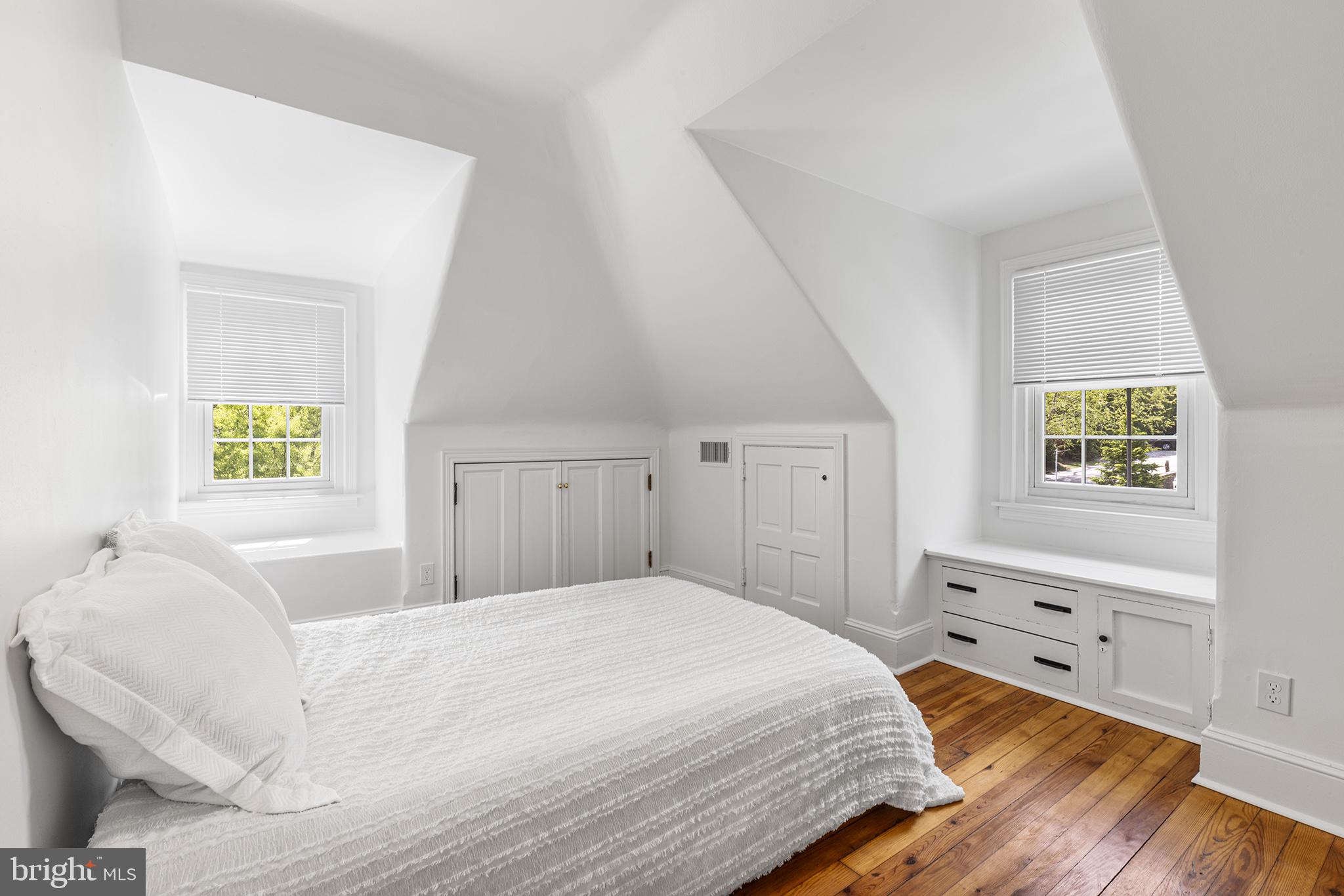 250 Conestoga Road, Unit 2 Wayne, PA 19087 - Photo 19 of 24 a bedroom with a bed and a window