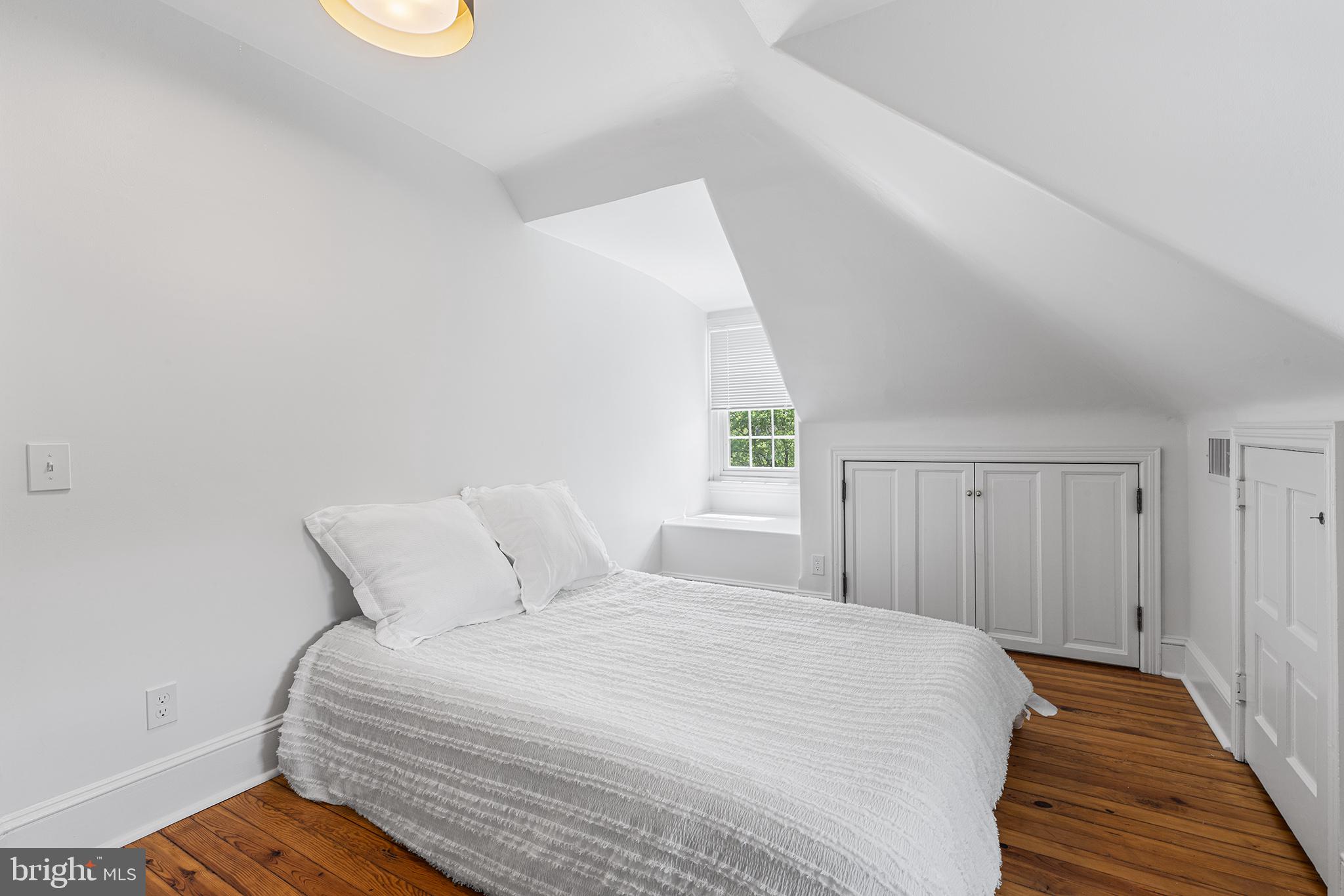 250 Conestoga Road, Unit 2 Wayne, PA 19087 - Photo 20 of 24 a bedroom with a bed and a window