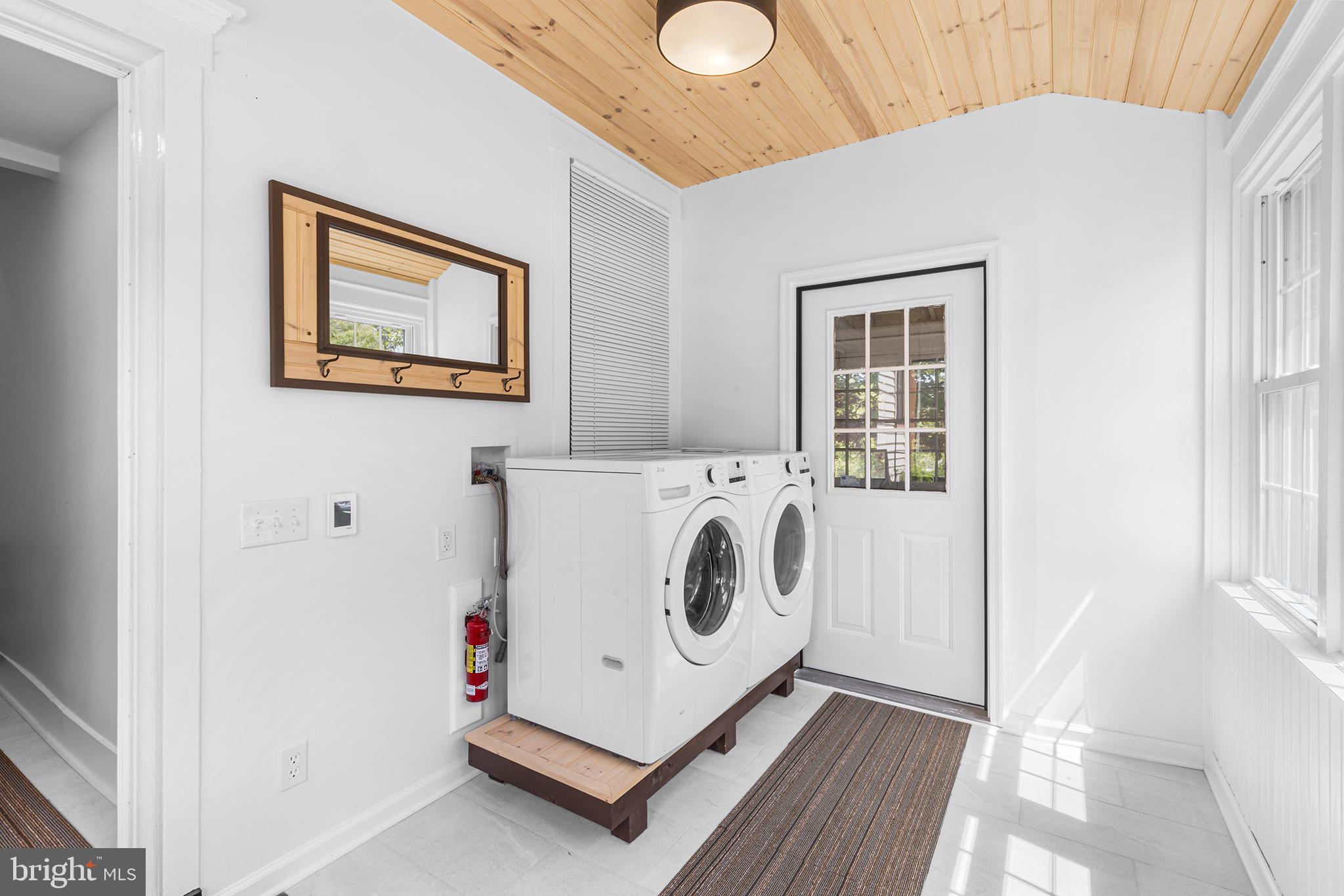 250 Conestoga Road, Unit 2 Wayne, PA 19087 - Photo 2 of 24 a utility room with dryer and washer