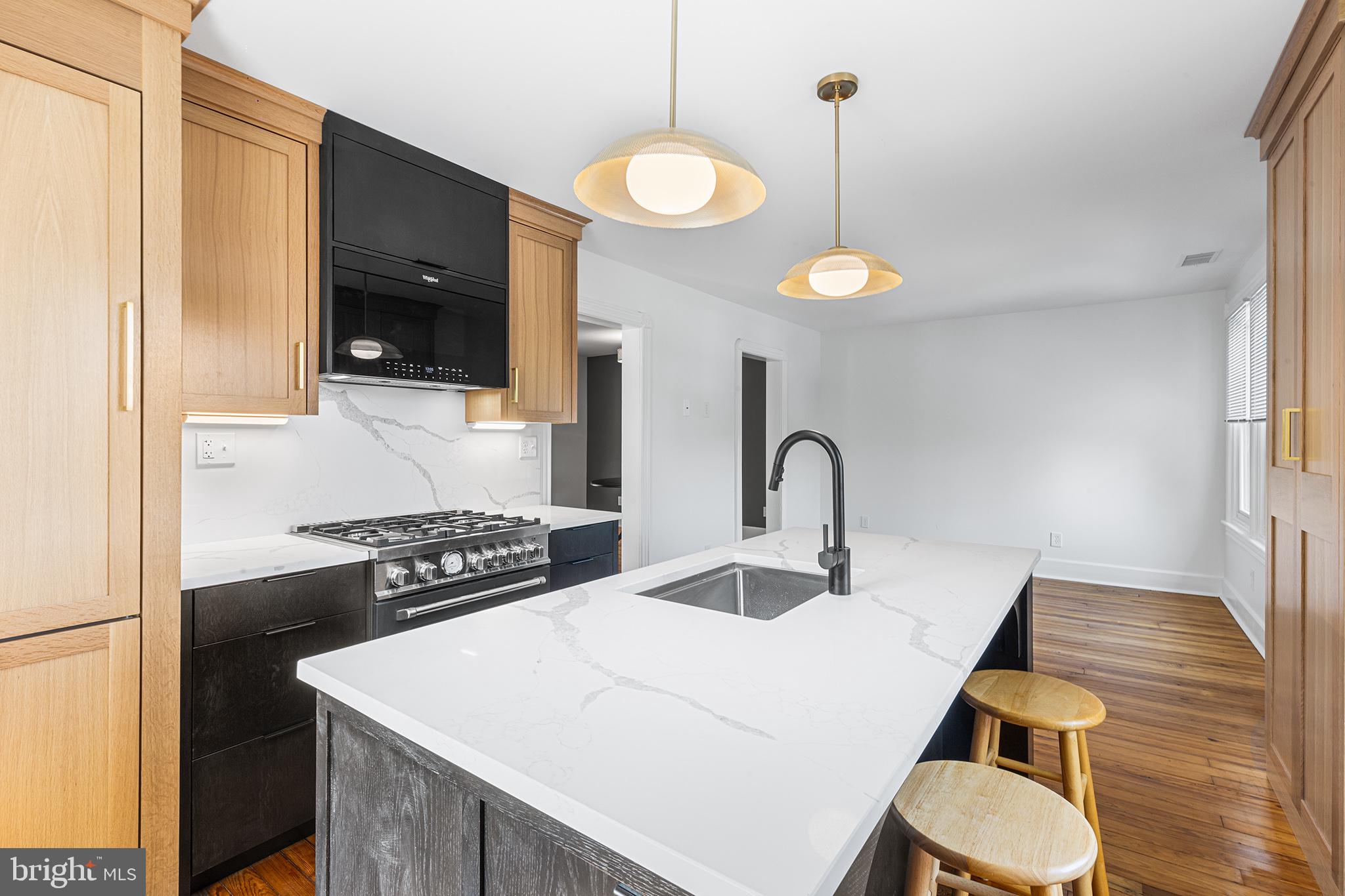 250 Conestoga Road, Unit 2 Wayne, PA 19087 - Photo 8 of 24 a kitchen with a table and chairs
