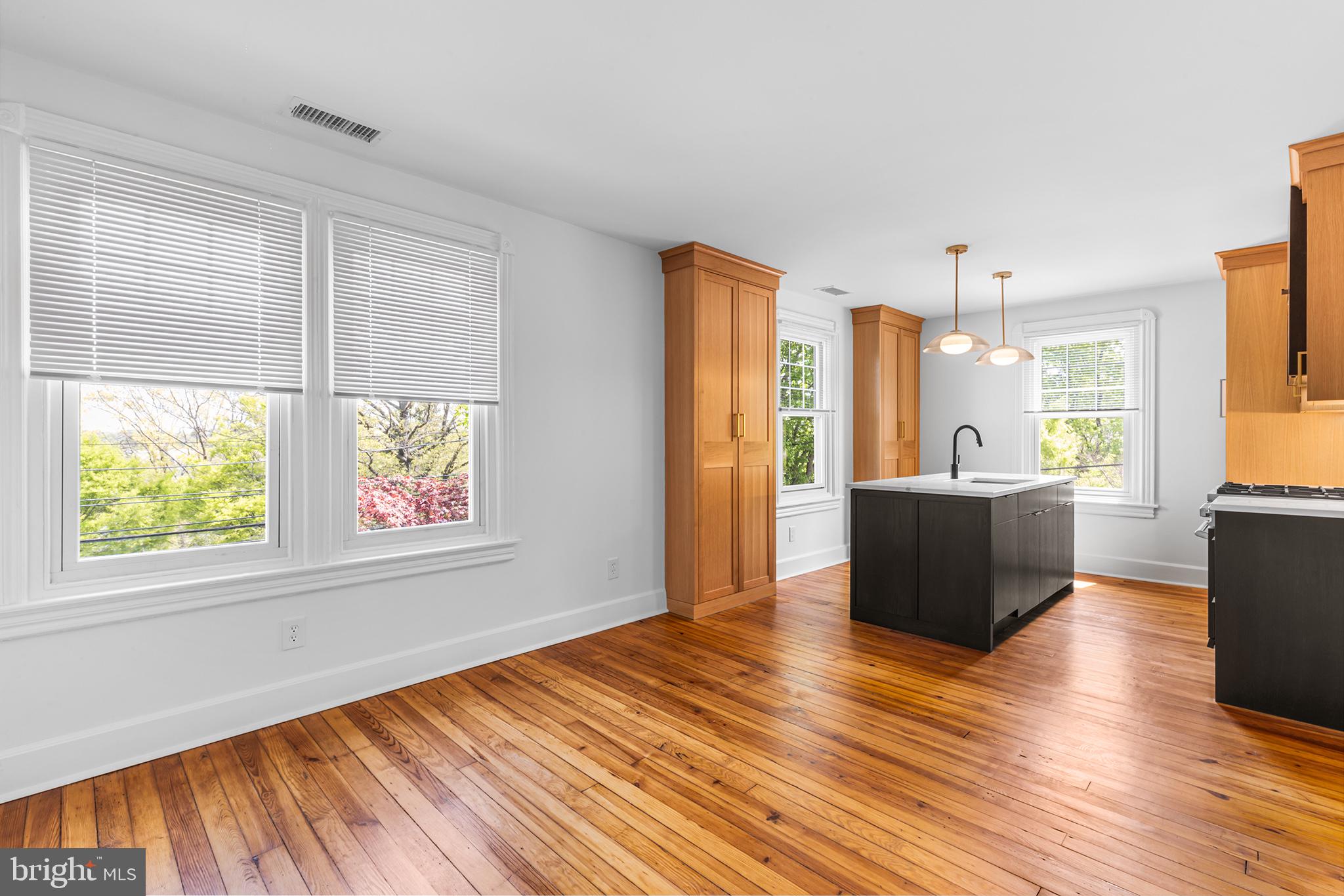 250 Conestoga Road, Unit 2 Wayne, PA 19087 - Photo 10 of 24 a view of kitchen with furniture and wooden floor