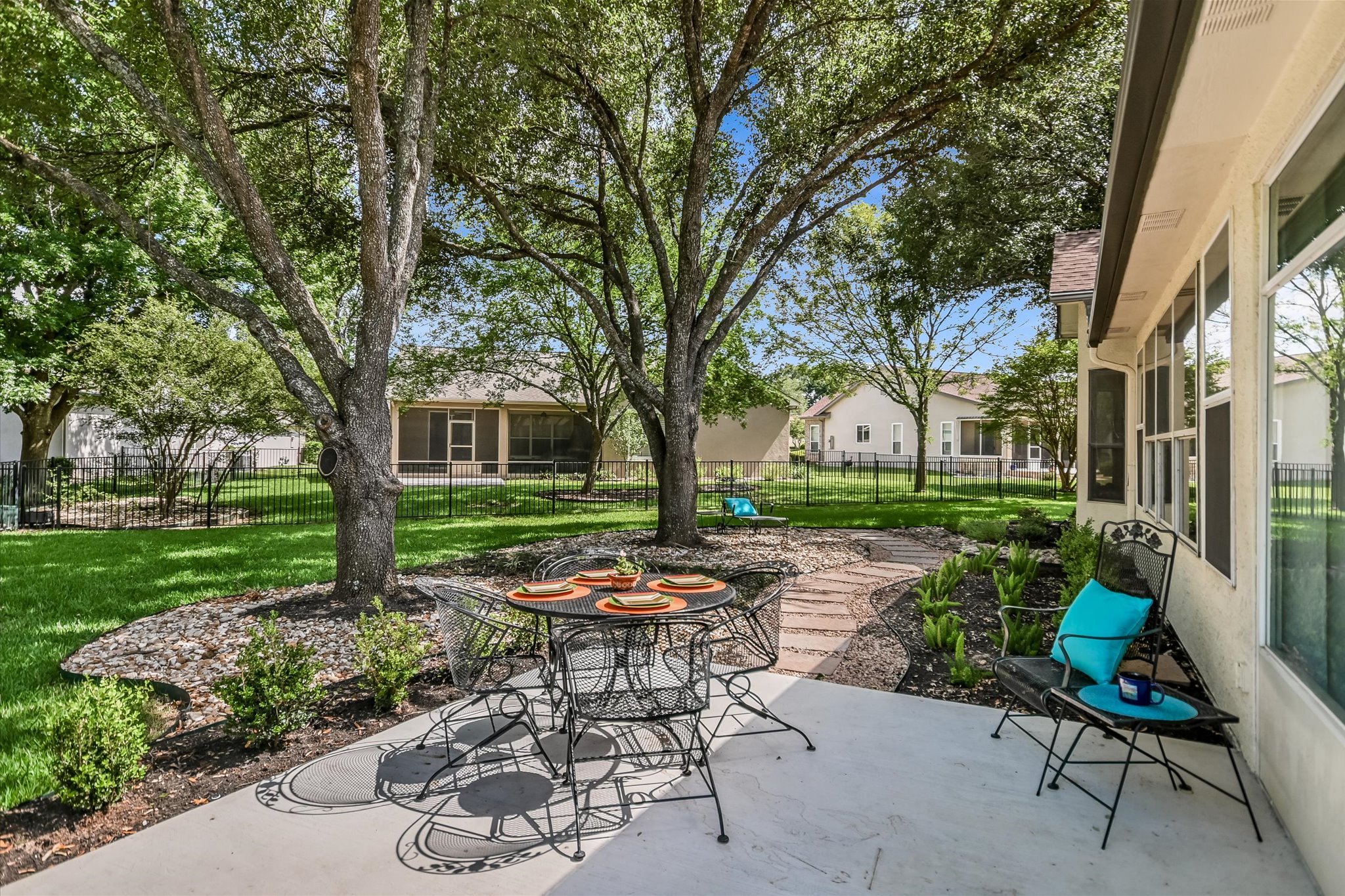 105 Stetson Circle Georgetown, TX 78633 - Photo 16 of 21 Recently added patio seating area and flat stone pathway. Enjoy the great outdoors under the beautiful mature trees.