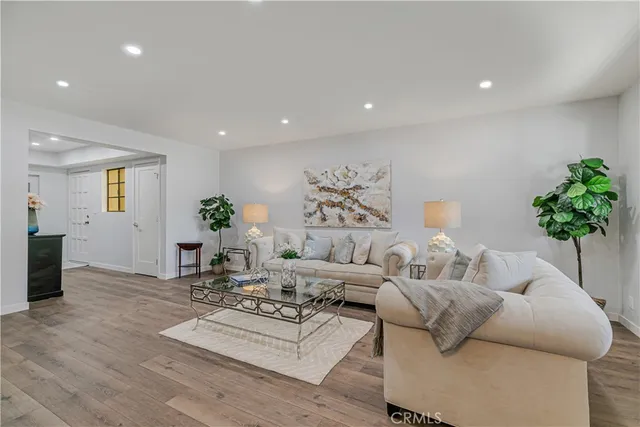 a kitchen with sink refrigerator and cabinets