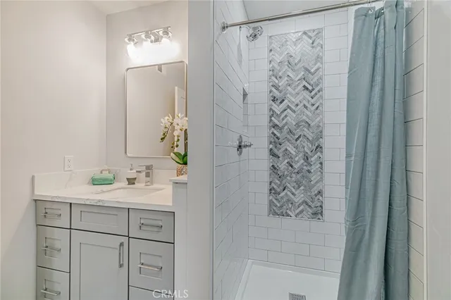 a bathroom with a shower and a sink