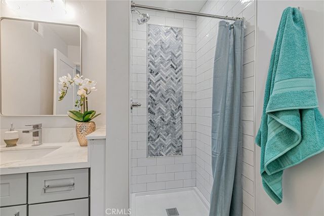 a bathroom with a bathtub and shower