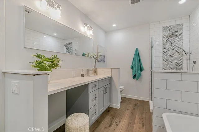 a bathroom with a sink a vanity and a mirror