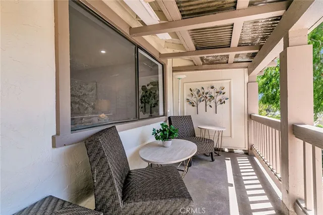 a view of a porch with furniture
