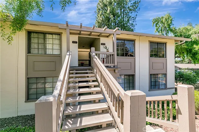 front view of a house with wooden deck