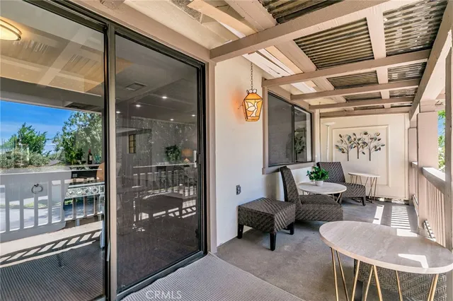 a row of palm trees in front of a house