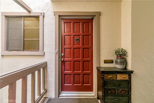 a view of living room filled with furniture and wooden floor