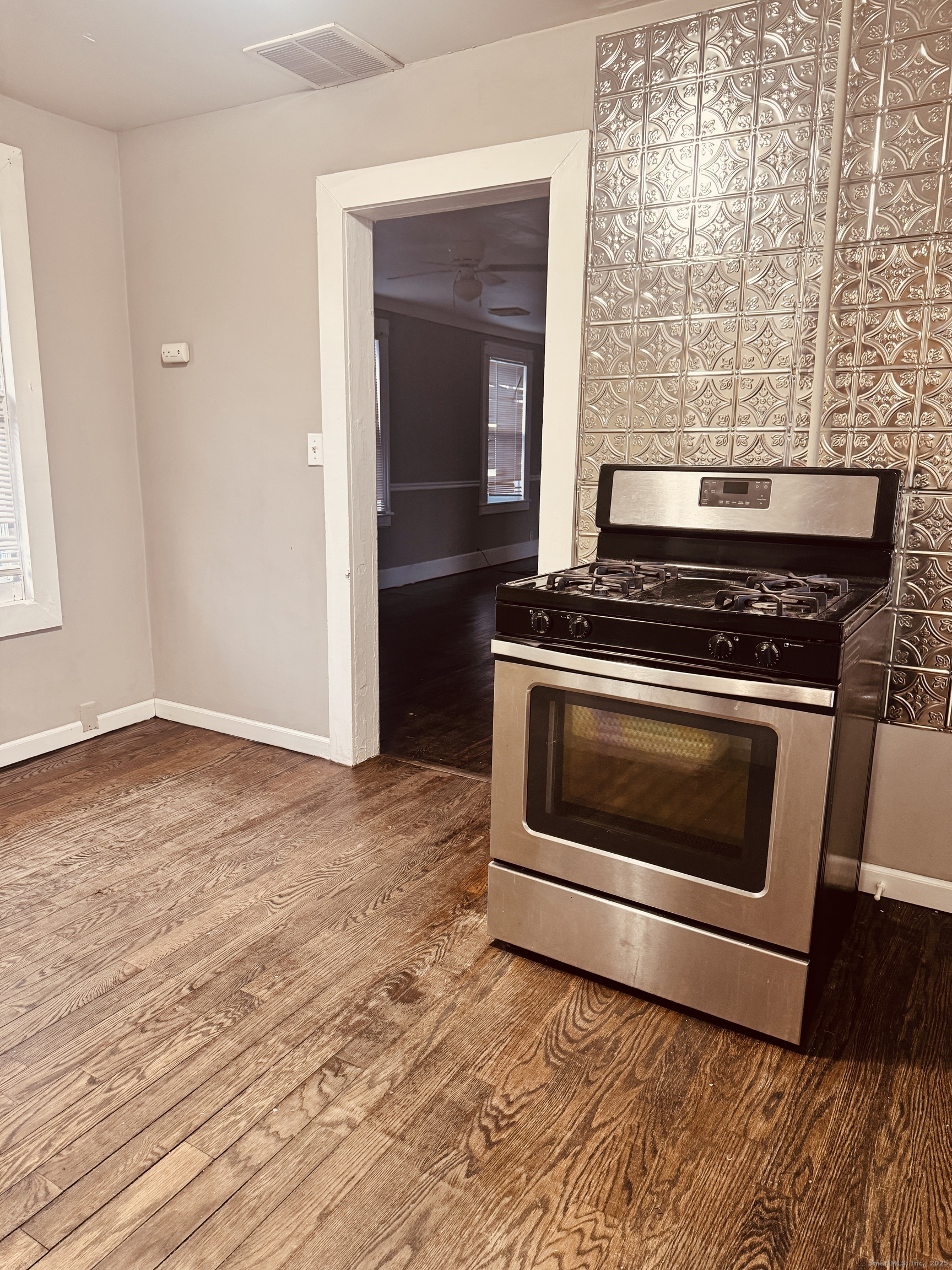 90 East Elm Street Torrington, CT 06790 - Photo 5 of 10 a stove top oven sitting inside of a kitchen