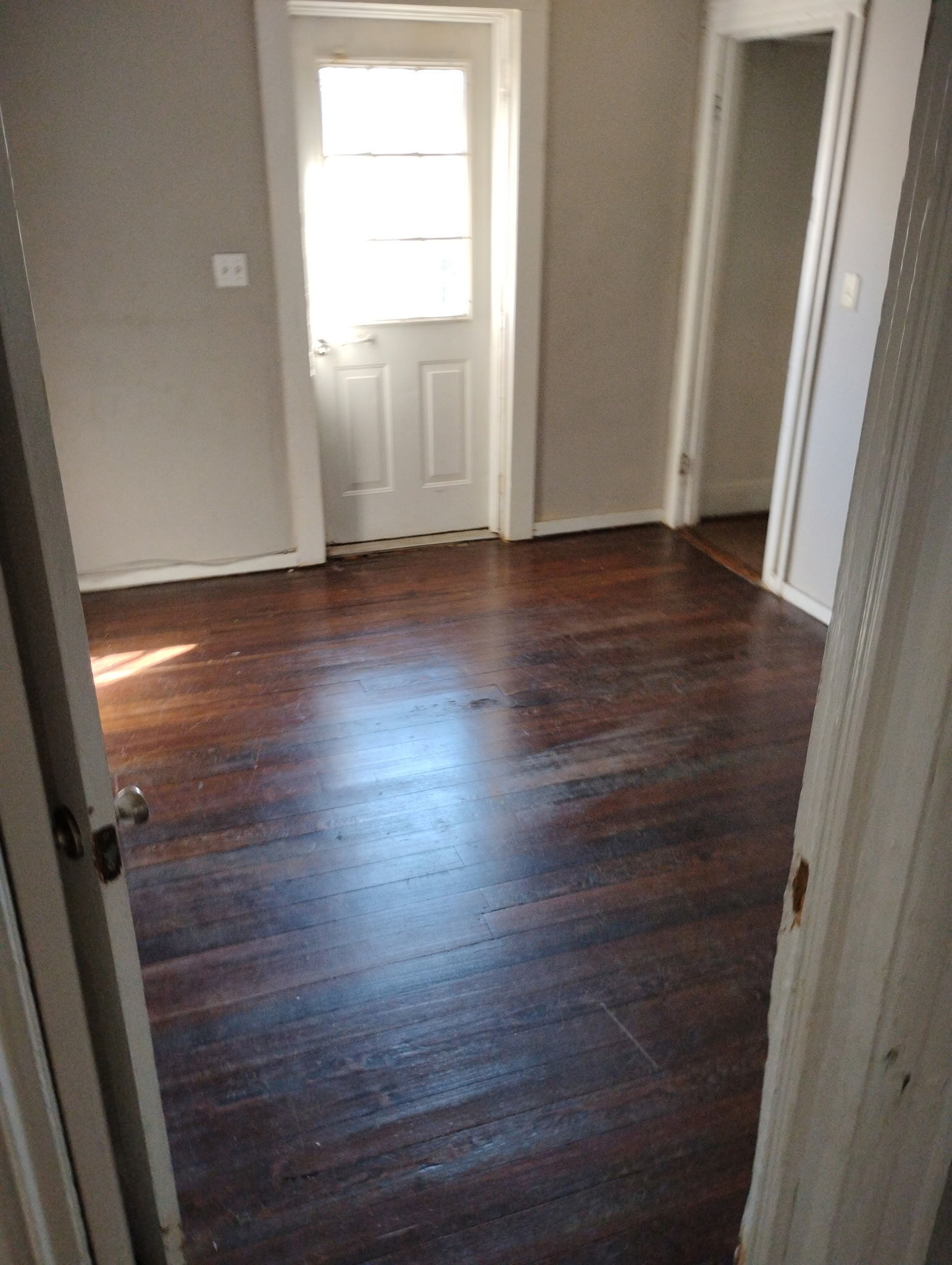 90 East Elm Street Torrington, CT 06790 - Photo 7 of 10 an empty room with wooden floor and windows