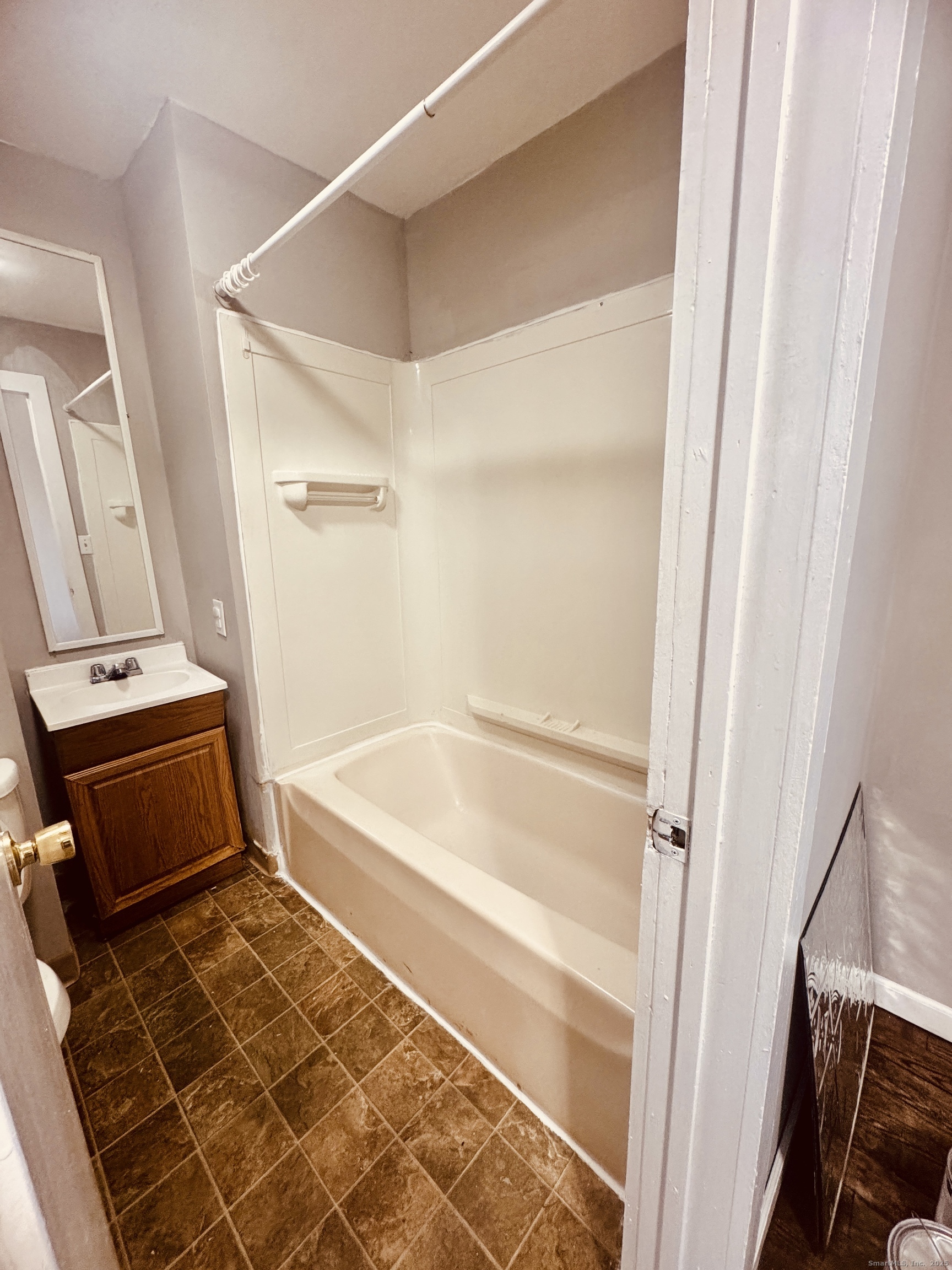 90 East Elm Street Torrington, CT 06790 - Photo 9 of 10 a bathroom with a bathtub and a shower