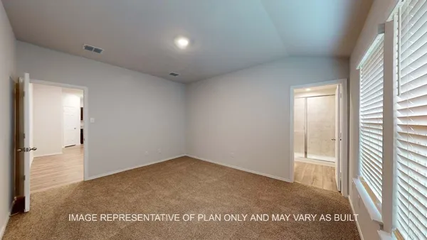 a view of an empty room and a window
