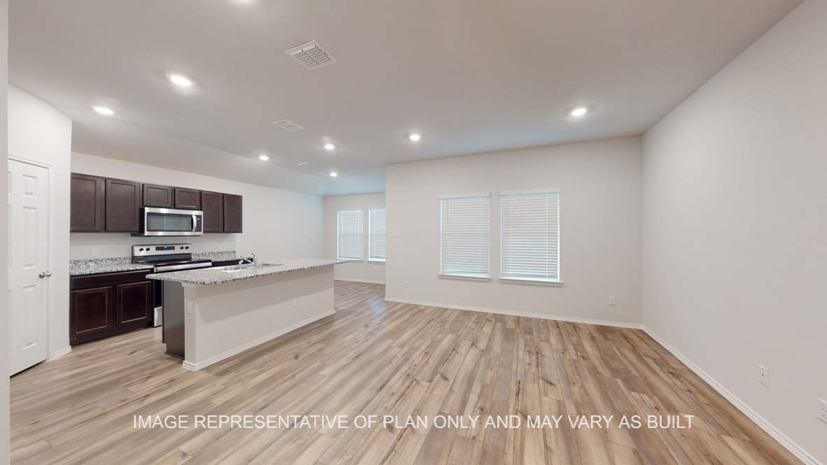 5675 Spoonbill Lane Orange, TX 77632 - Photo 4 of 22 a large kitchen with stainless steel appliances a large counter top and a stove top oven