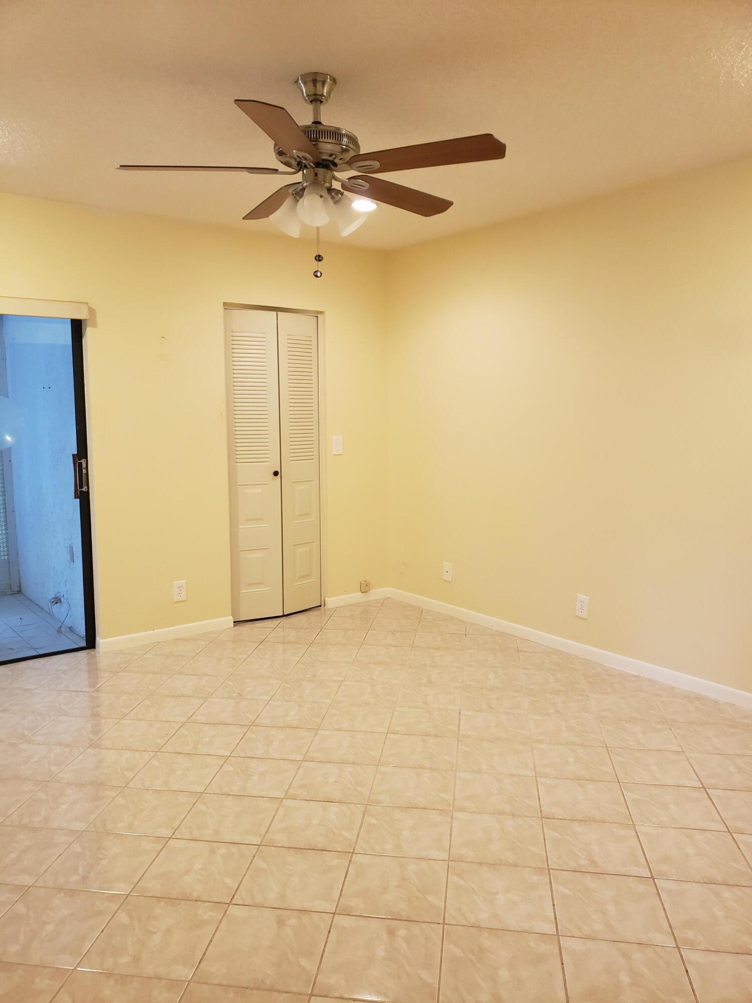 10875 Lake Front Place, Unit 10875 Boca Raton, FL 33498 - Photo 6 of 18 Tiled Master Bedroom