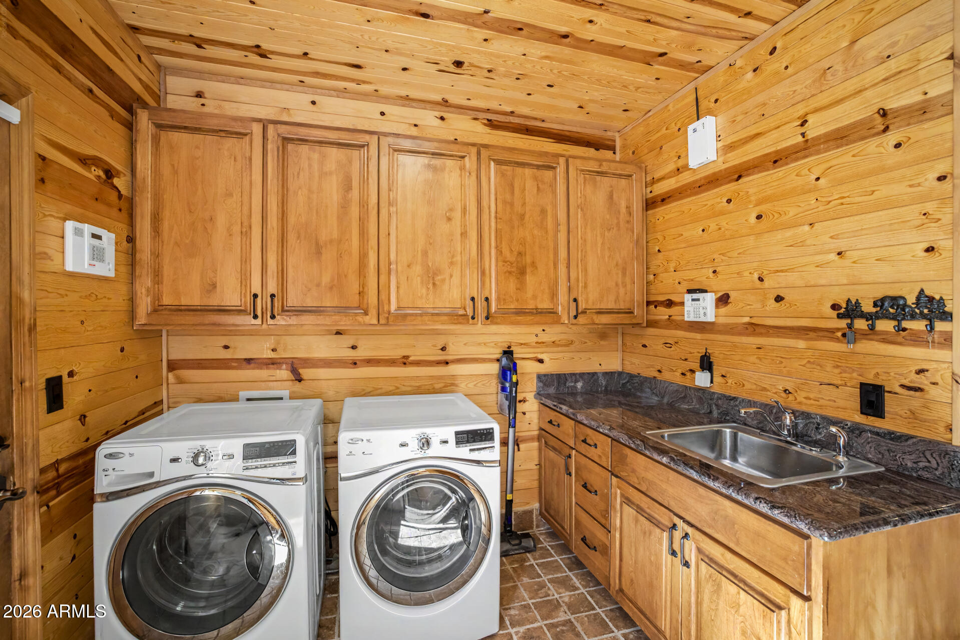 1681 South Jimson Loop Show Low, AZ 85901 - Photo 65 of 105 a utility room with sink dryer and washer