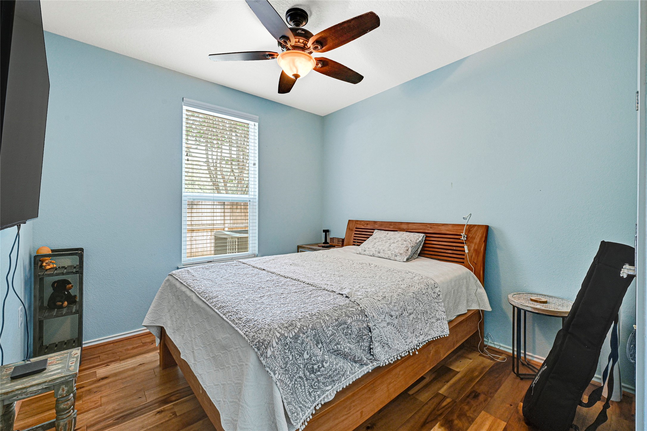 13600 Breton Ridge Street, Unit 4A Houston, TX 77070 - Photo 26 of 49 Primary bedroom with wood flooring and abundant natural light